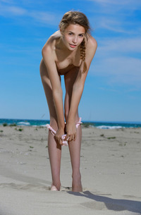Russian Elle Tan Stripping On The Beach