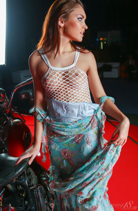 Cristina A Riding Bike In White Fishnet