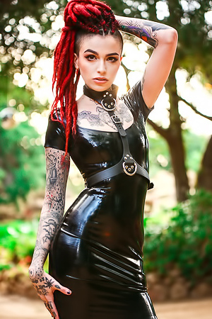 Tattooed Girl In Black Latex Dress