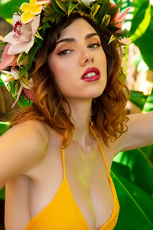 Azura Grace Teases In A Yellow Bikini And Nude Poses Amid Banana Leaves And A White Chair Outdoors