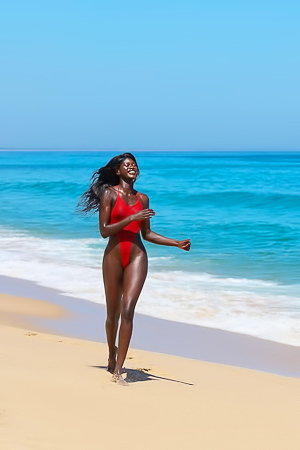 Naomi Nash Bares All On The Beach With Glitter Skin And Red Float Under Blue Sky For Playboy